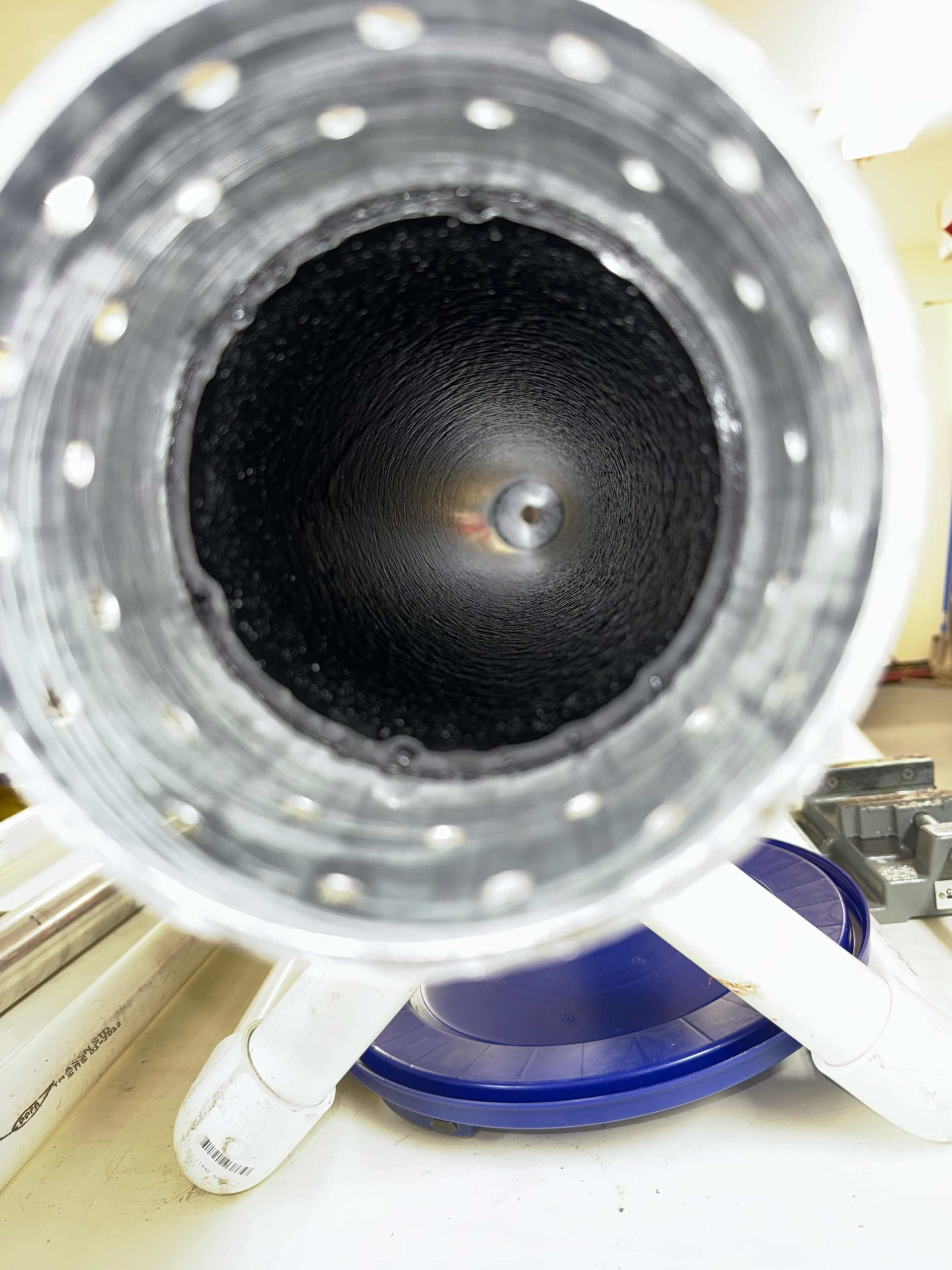 Interior view of a lined cylindrical component.